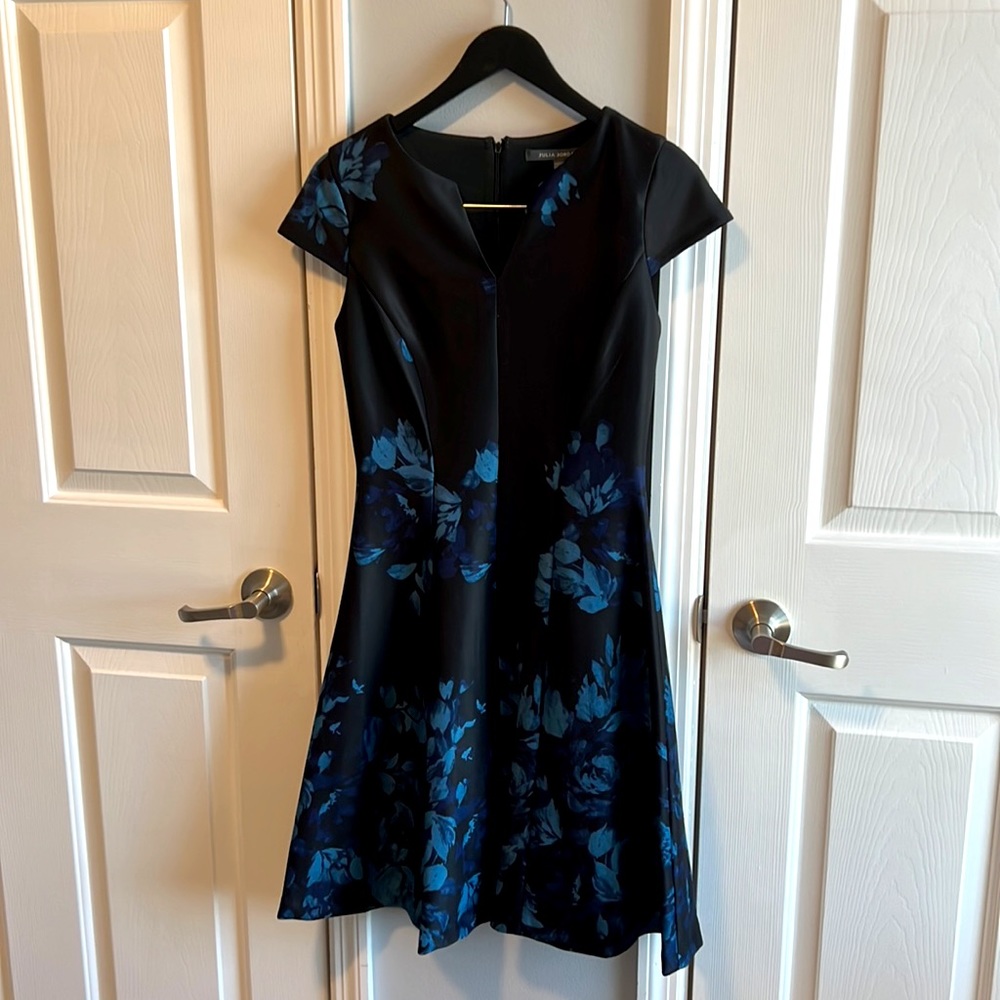 Black with blue floral mid length, dress.